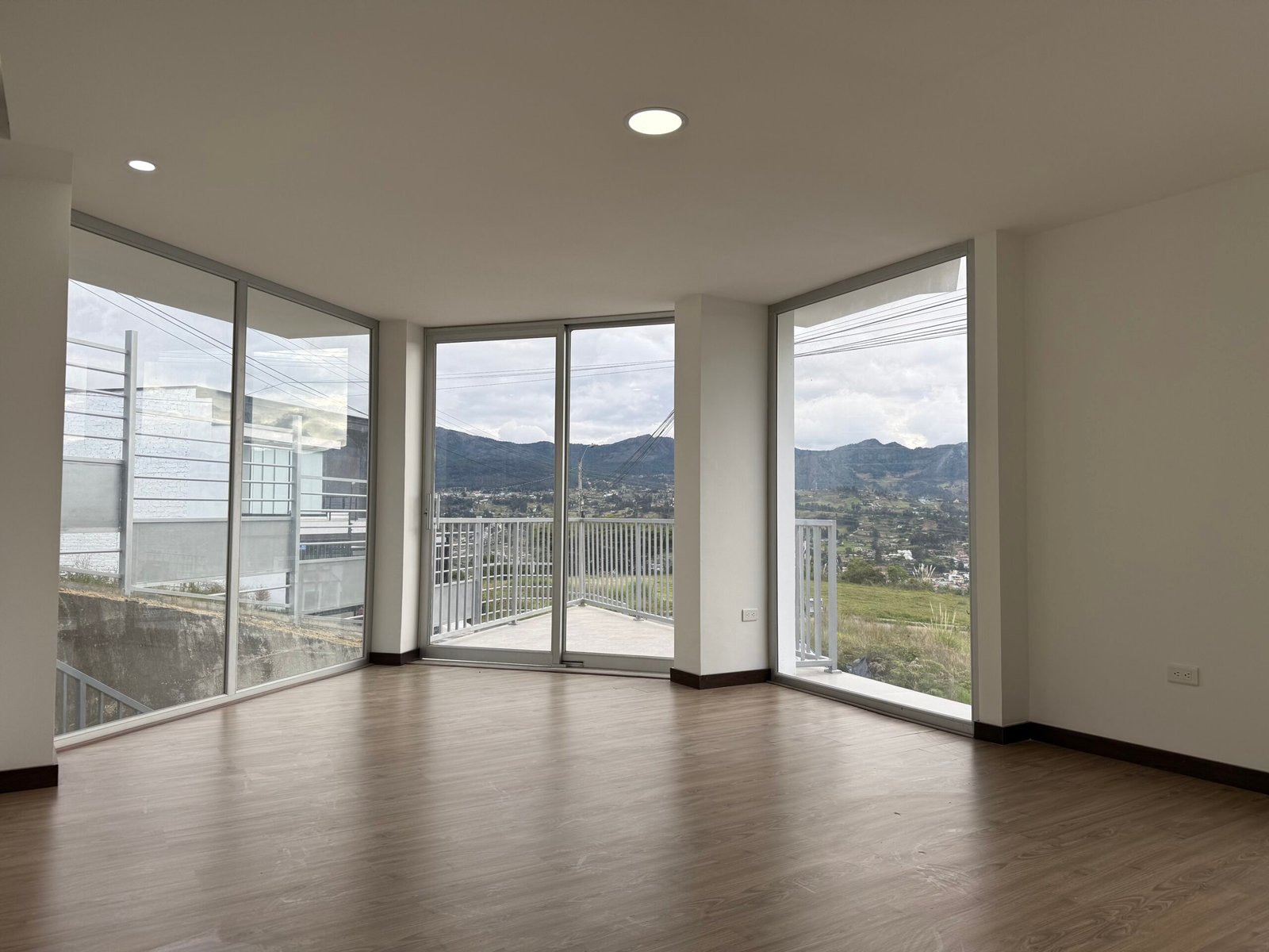 Bright living room with hillside views in Altos del Valle