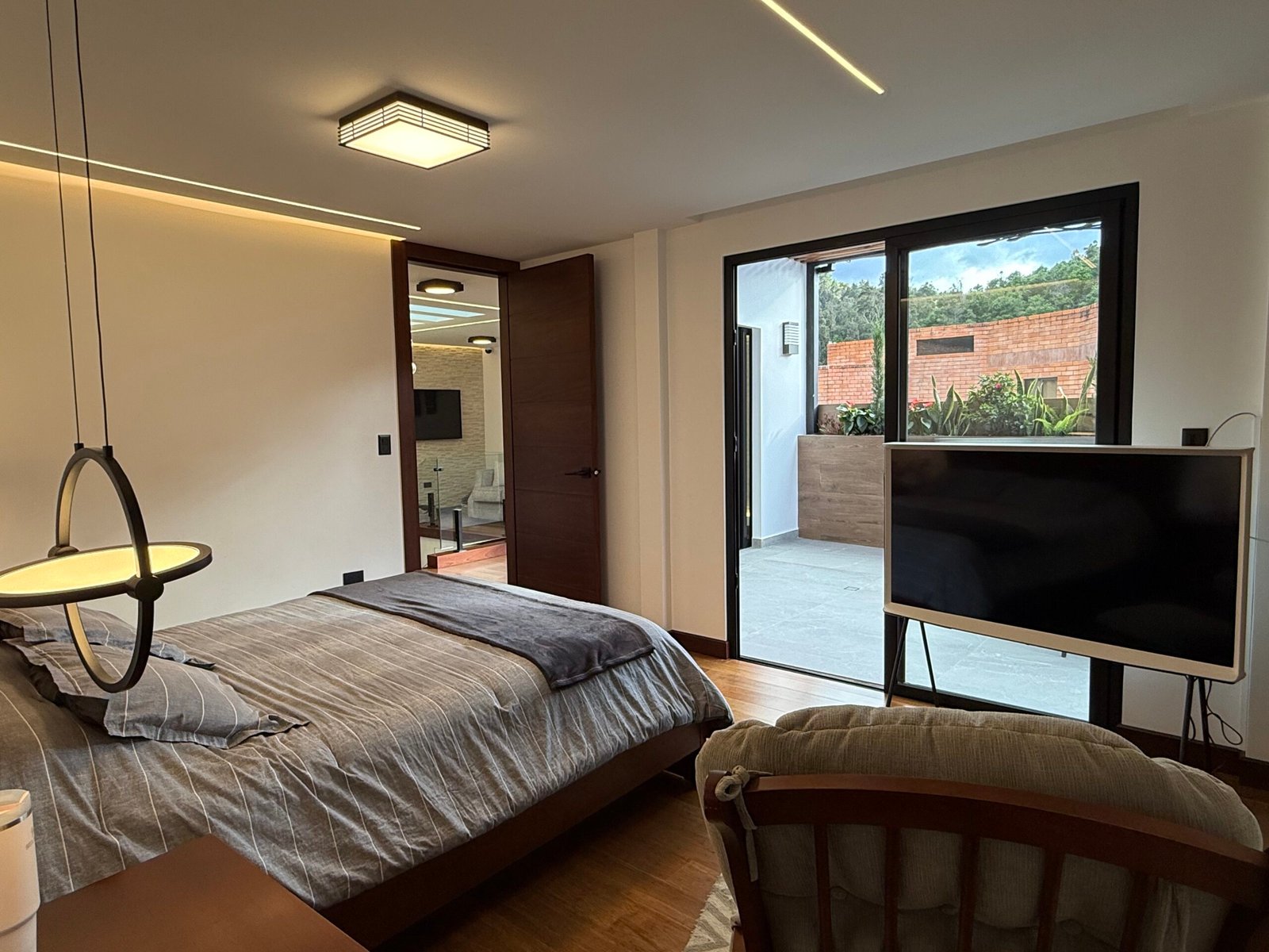 Furnished bedroom opening onto the private terrace