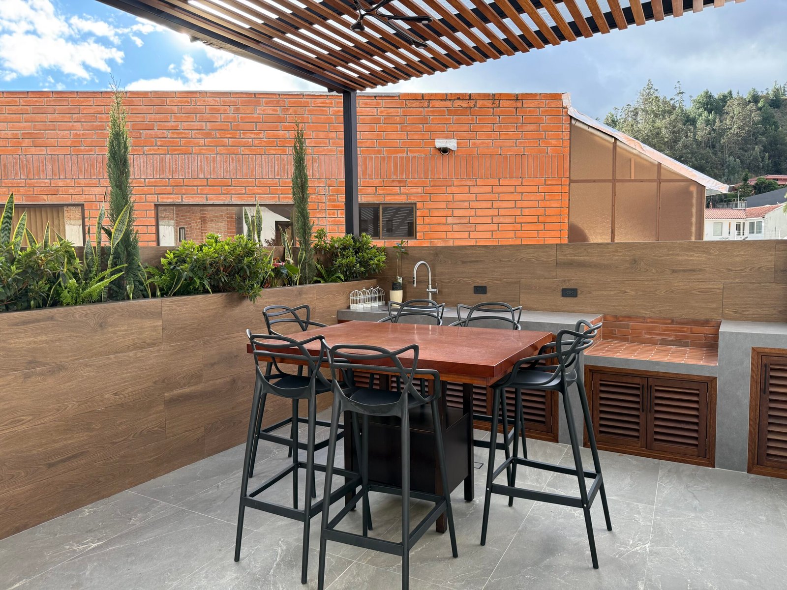 Private terrace with outdoor dining area and pergola
