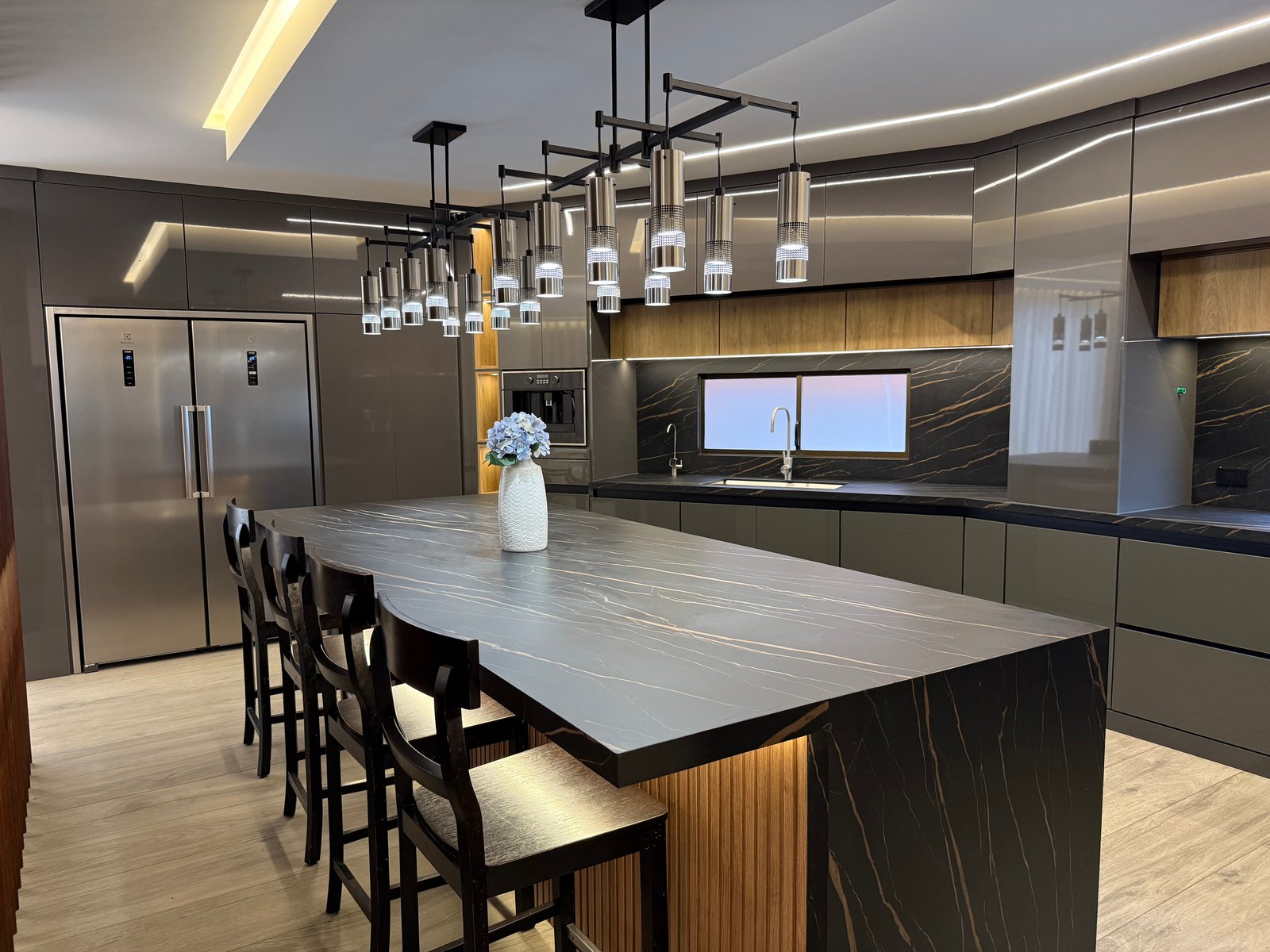 Modern furnished kitchen with a large island and pendant lighting