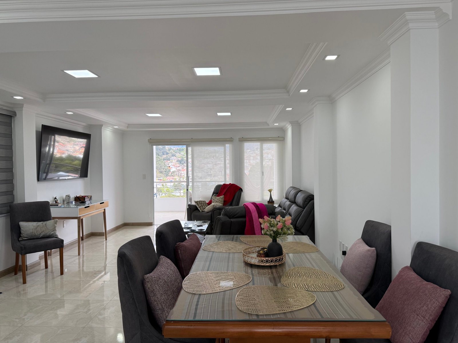 Furnished living and dining room in the Estancia Norte duplex apartment for sale in Loja Ecuador