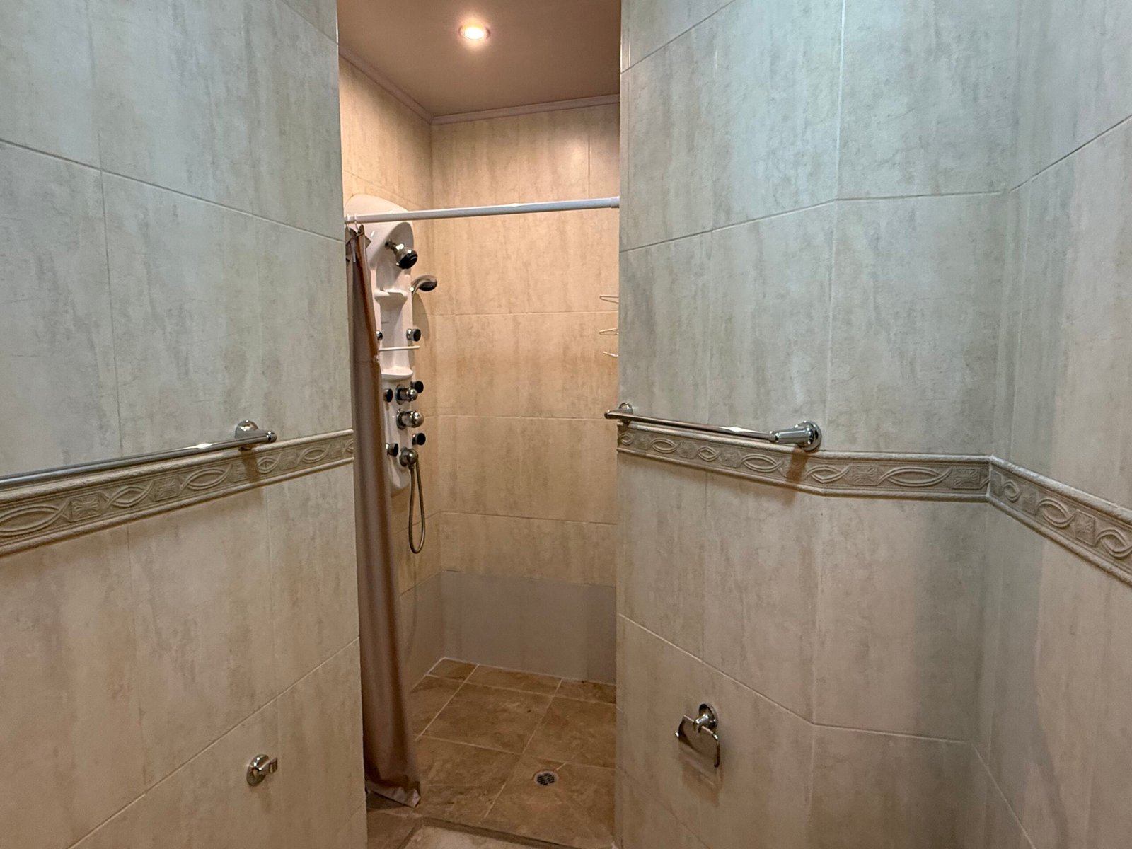 Full bathroom with tiled walk-in shower
