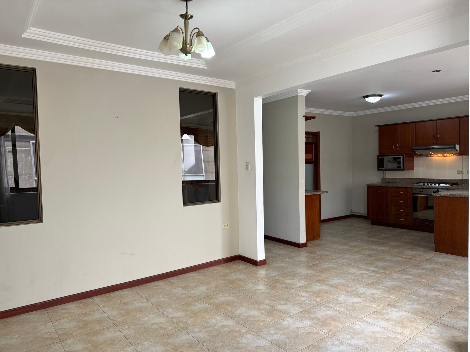 Spacious living area connected to the fitted kitchen