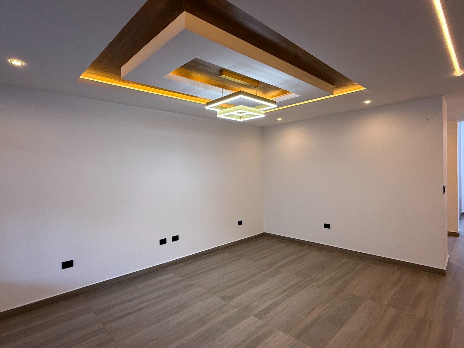 Bright interior room with indirect lighting in the Parkenor home