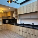 Modern wood-finish kitchen in the Parkenor house