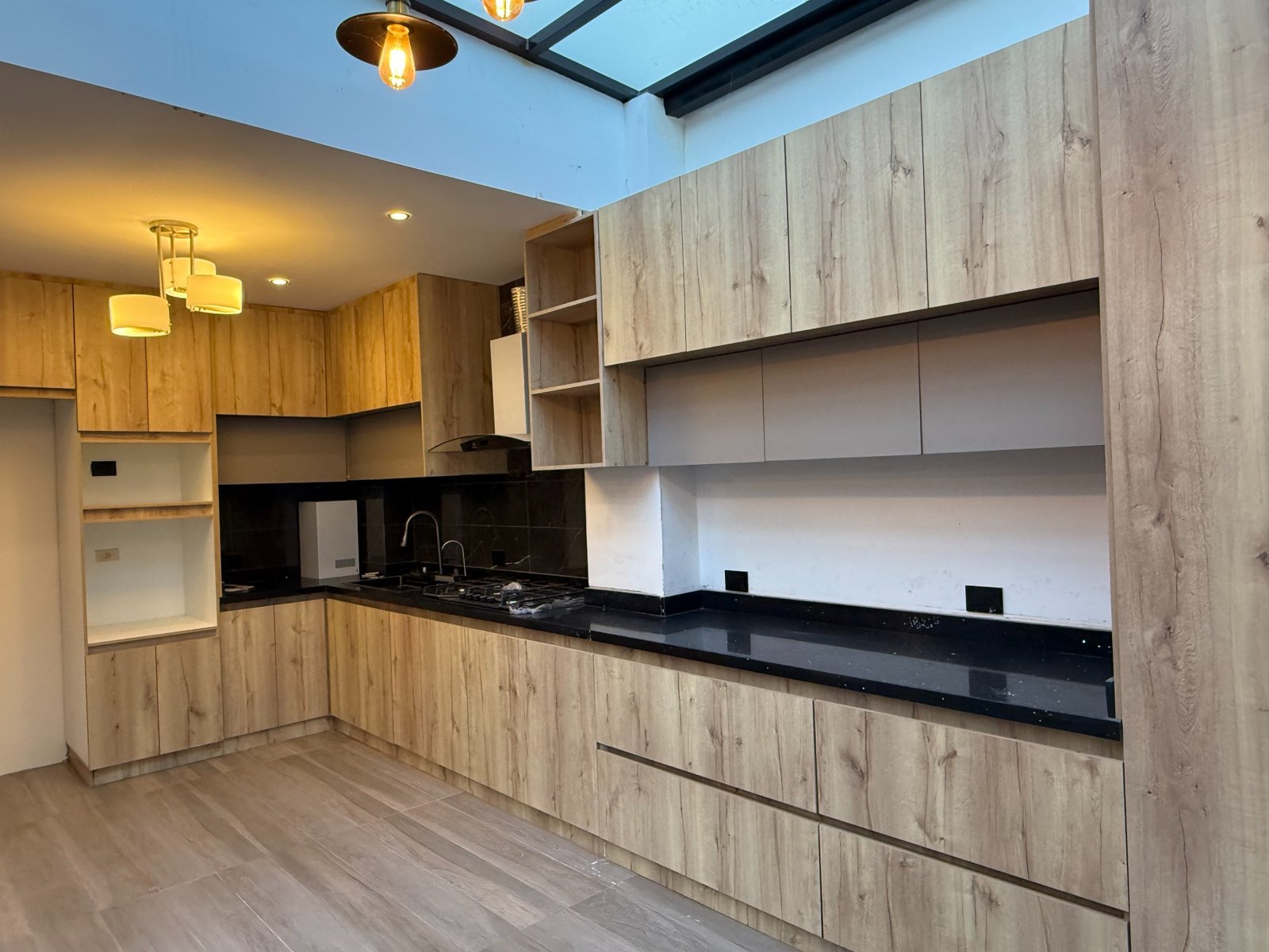 Modern wood-finish kitchen in the Parkenor house