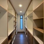 Walk-in closet with built-in storage in the Parkenor home