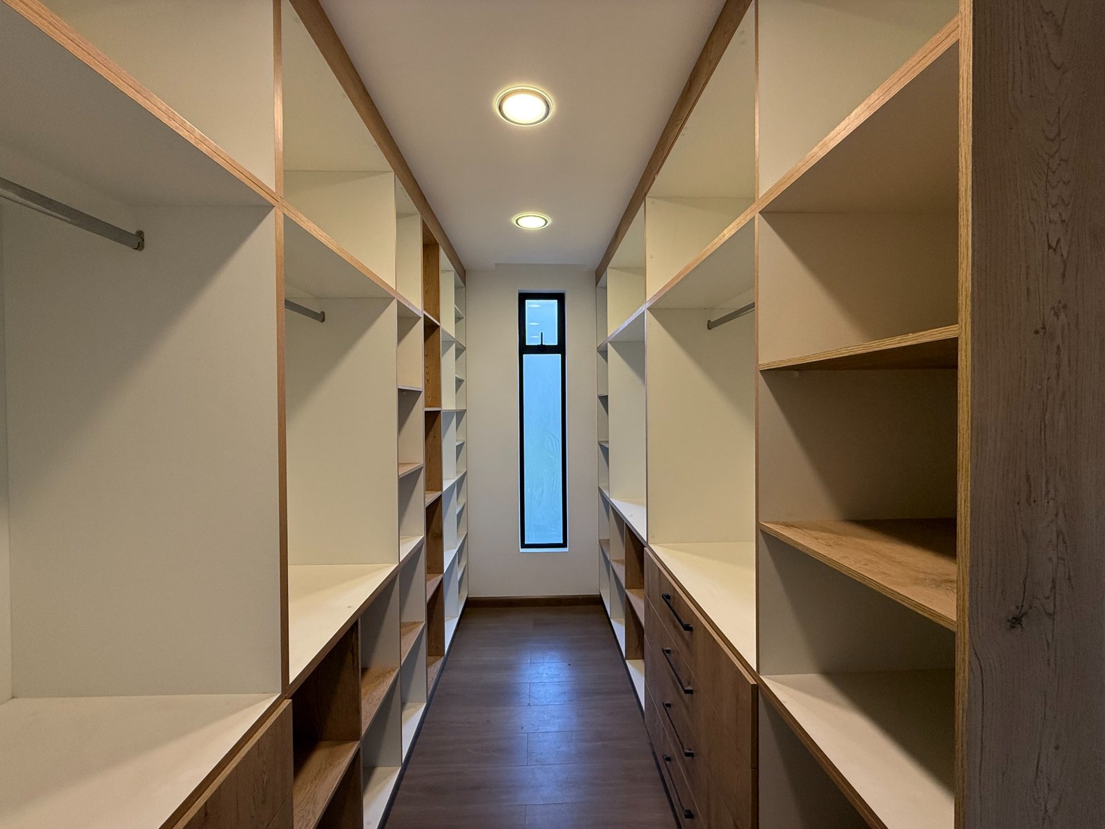 Walk-in closet with built-in storage in the Parkenor home