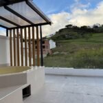 Private terrace with jacuzzi, pergola and hillside views in Parkenor