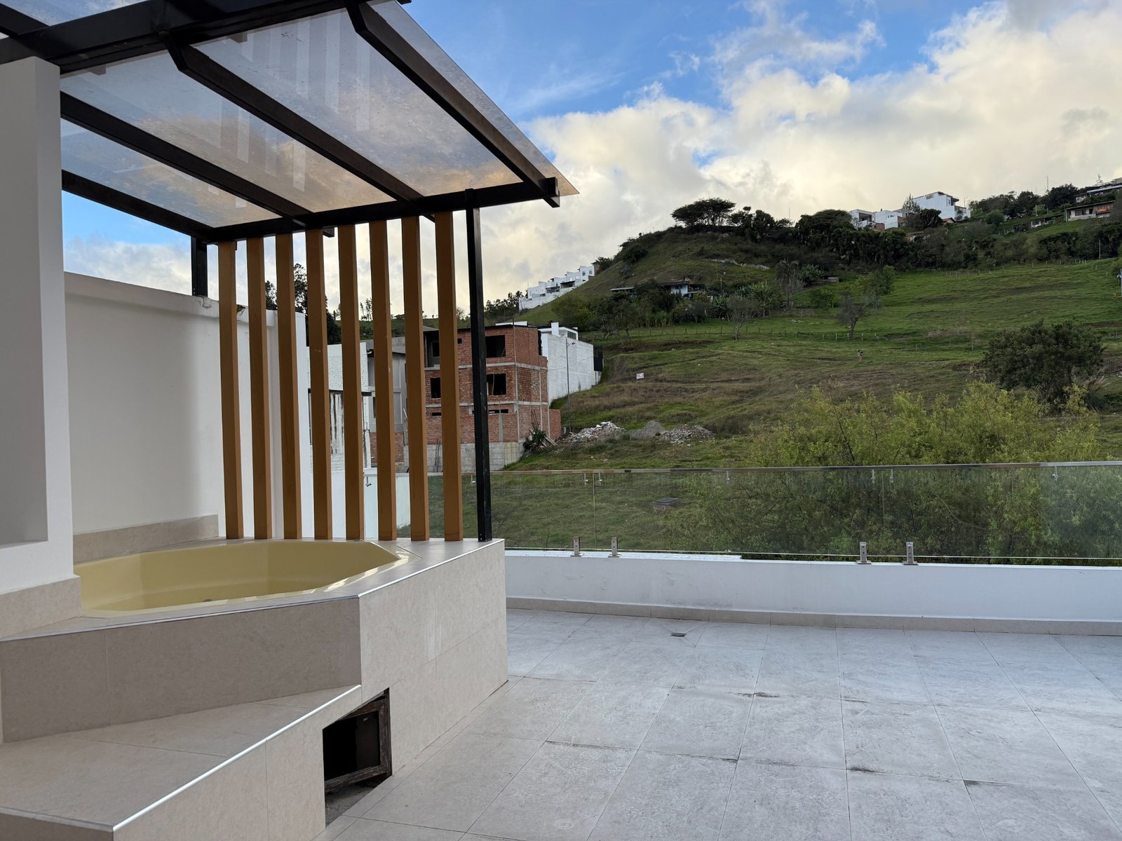 Private terrace with jacuzzi, pergola and hillside views in Parkenor