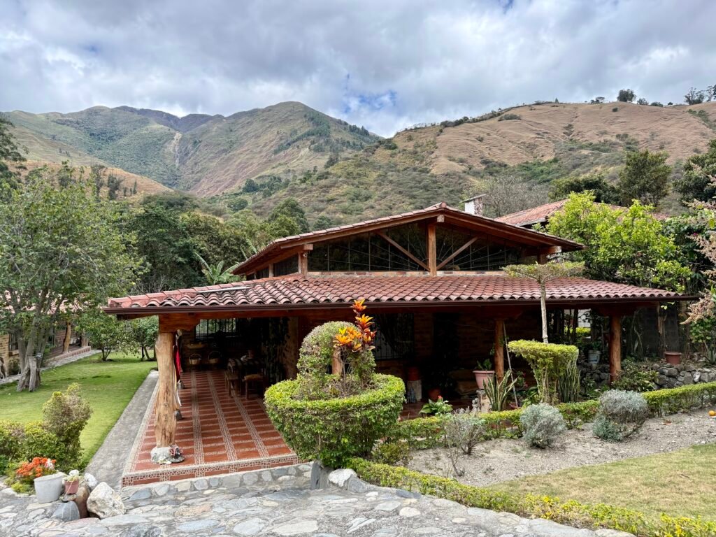 Exterior of the country house with a mountain backdrop