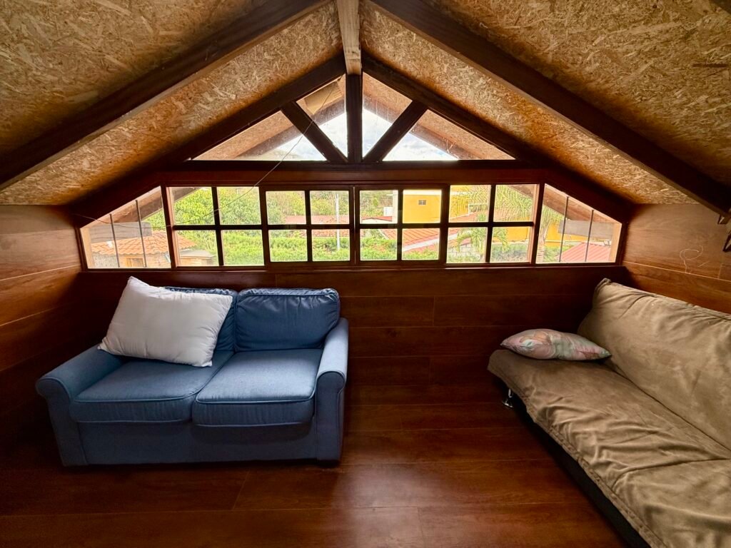 Loft seating area with a wide window