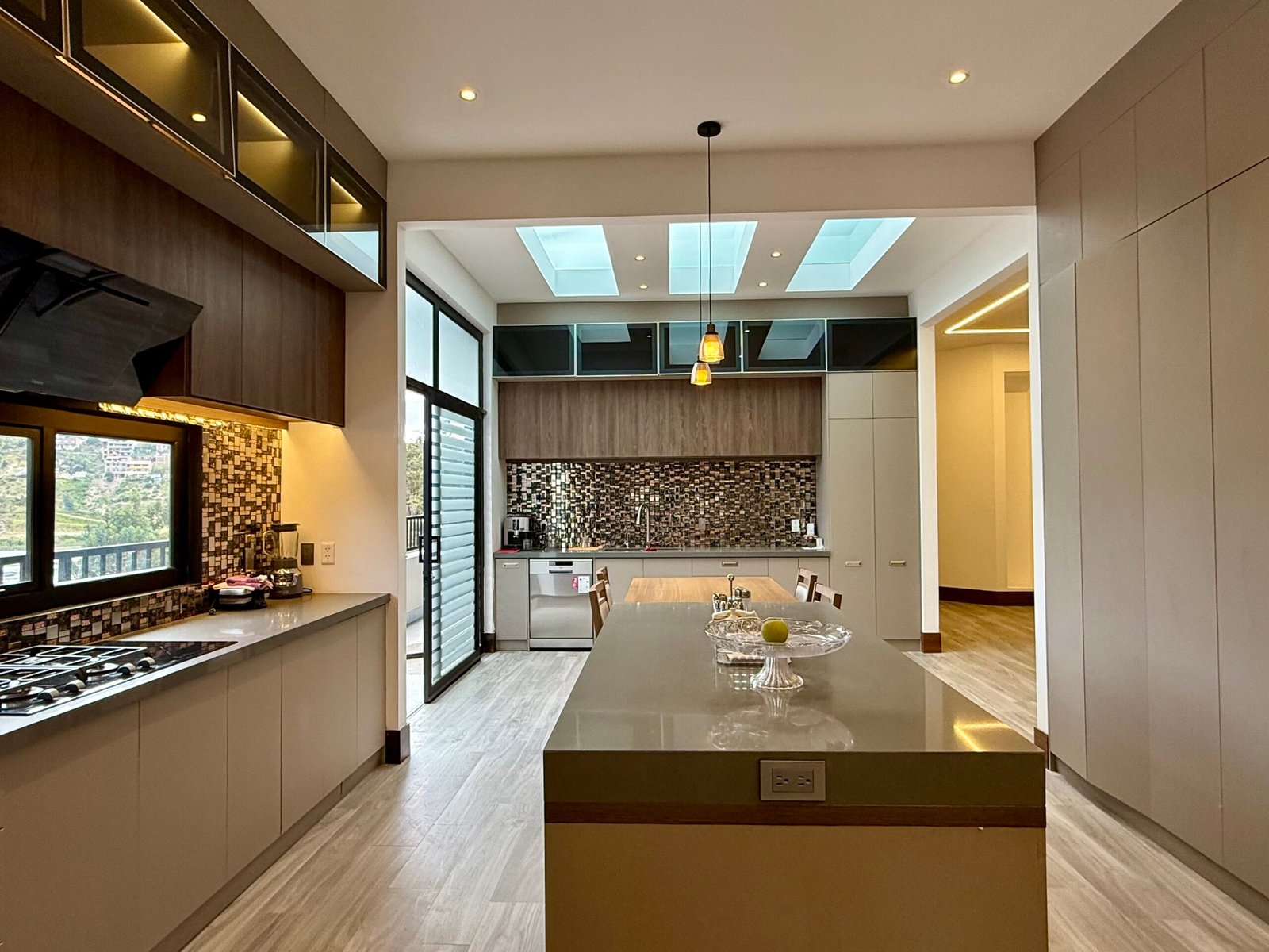 Large modern kitchen with island and skylights
