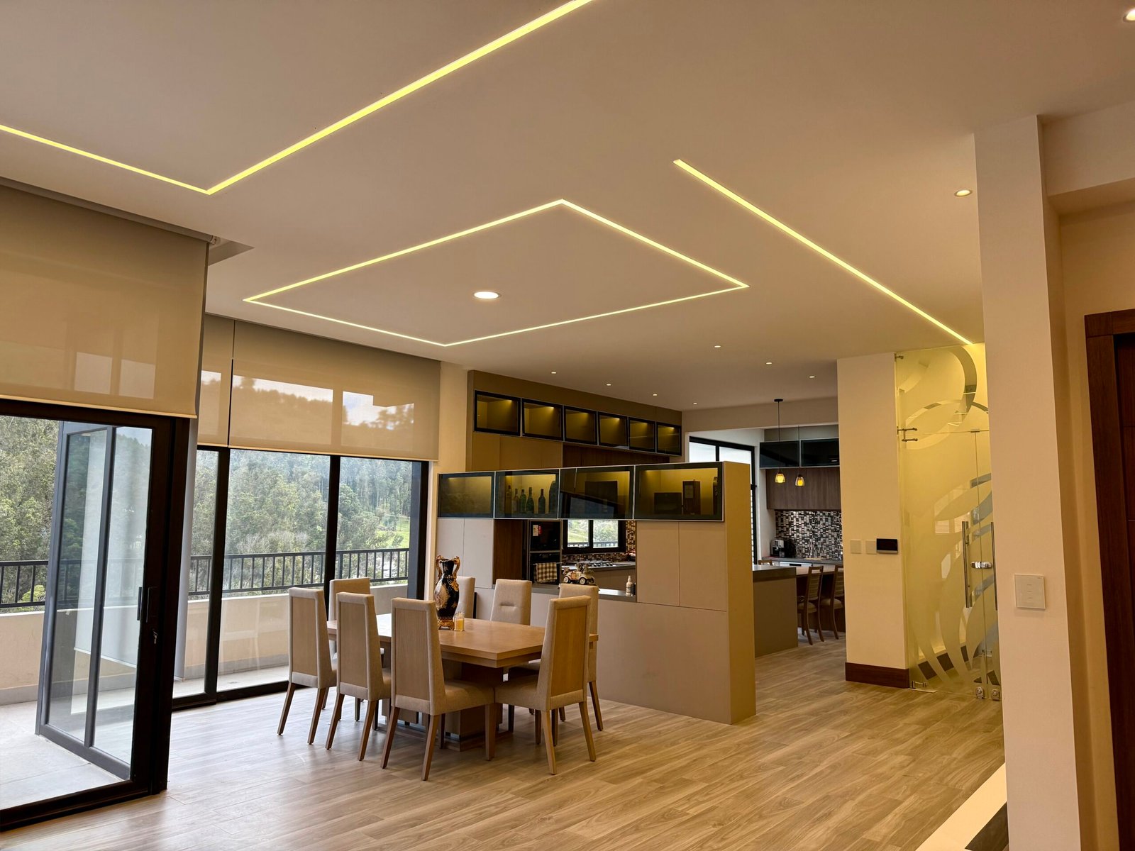 Open-plan dining area with balcony and mountain views