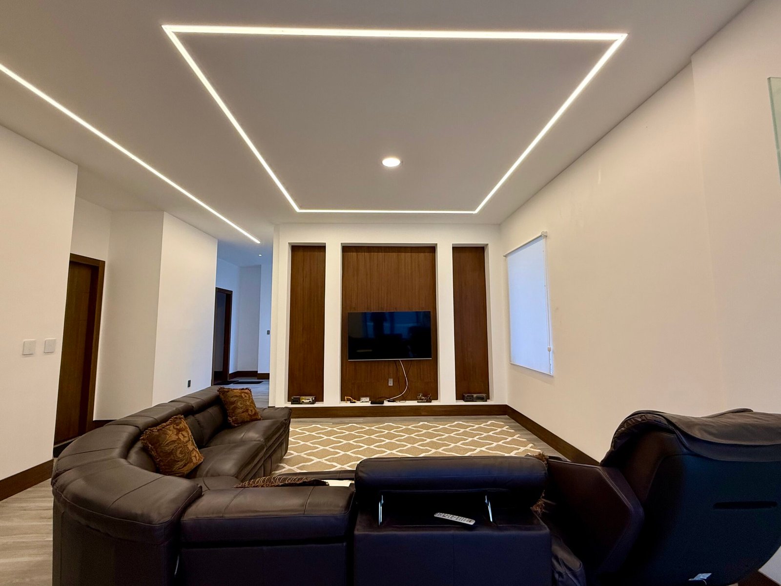 Spacious interior with geometric LED ceiling lighting