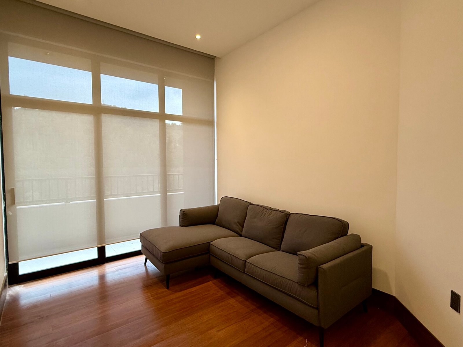 Bedroom with large windows and mountain views
