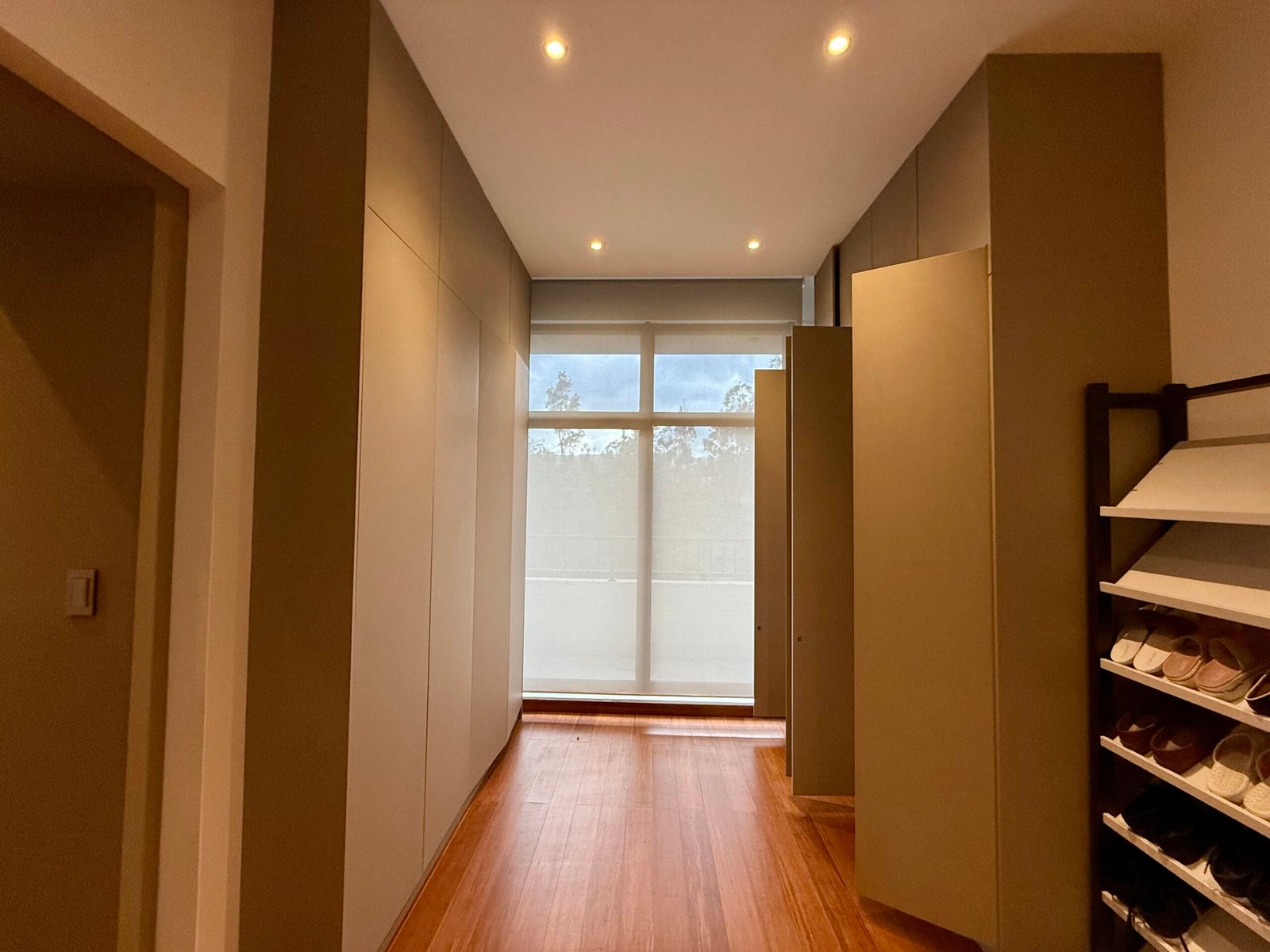 Interior hallway with warm recessed lighting