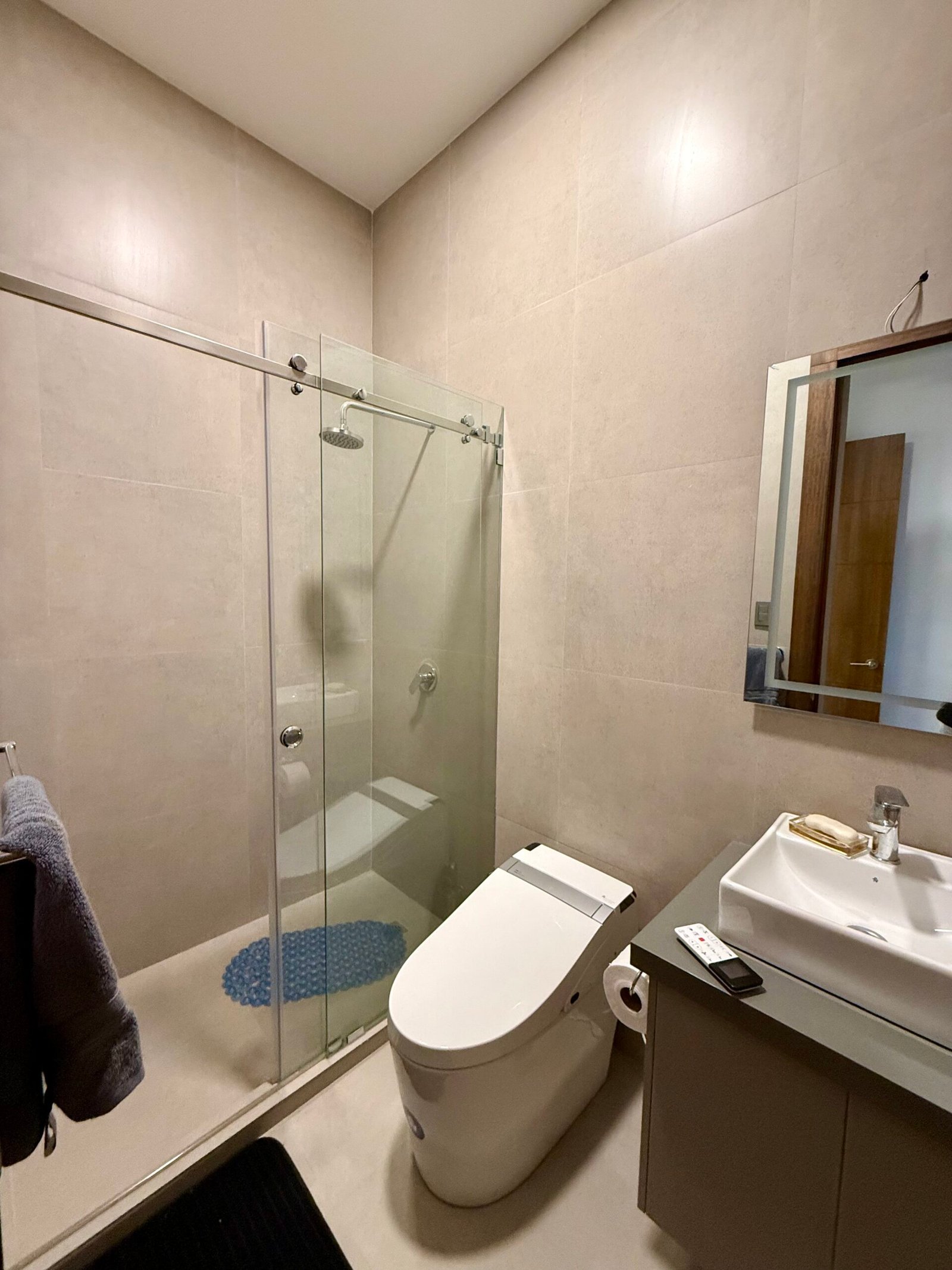 Glass-enclosed shower in a modern bathroom