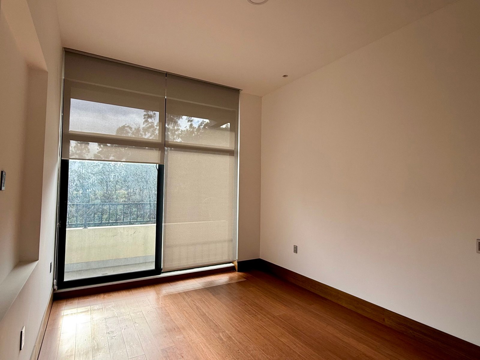 Bright bedroom with large windows