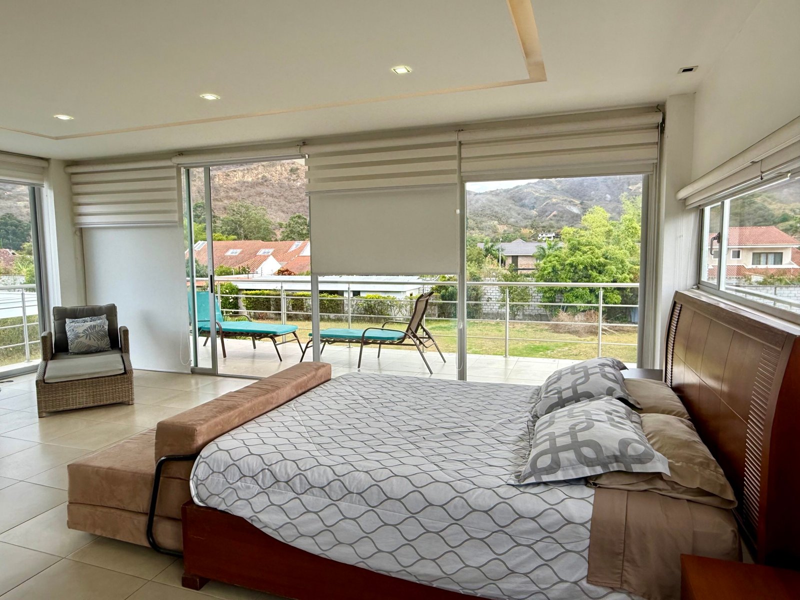 Bedroom overlooking the swimming pool and garden