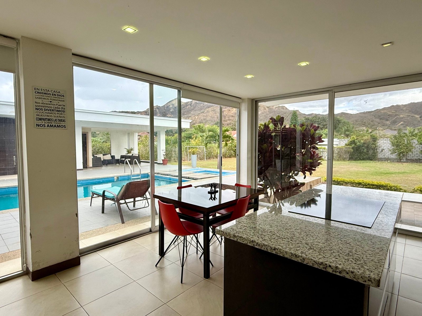 Dining area overlooking the pool and garden