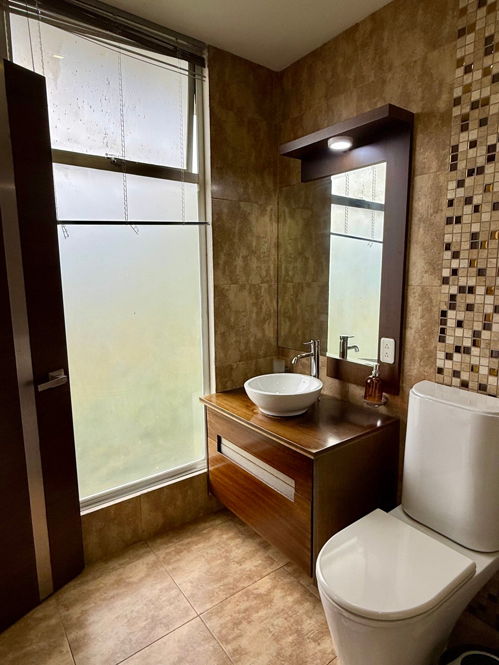 Bathroom with glass shower and mountain views