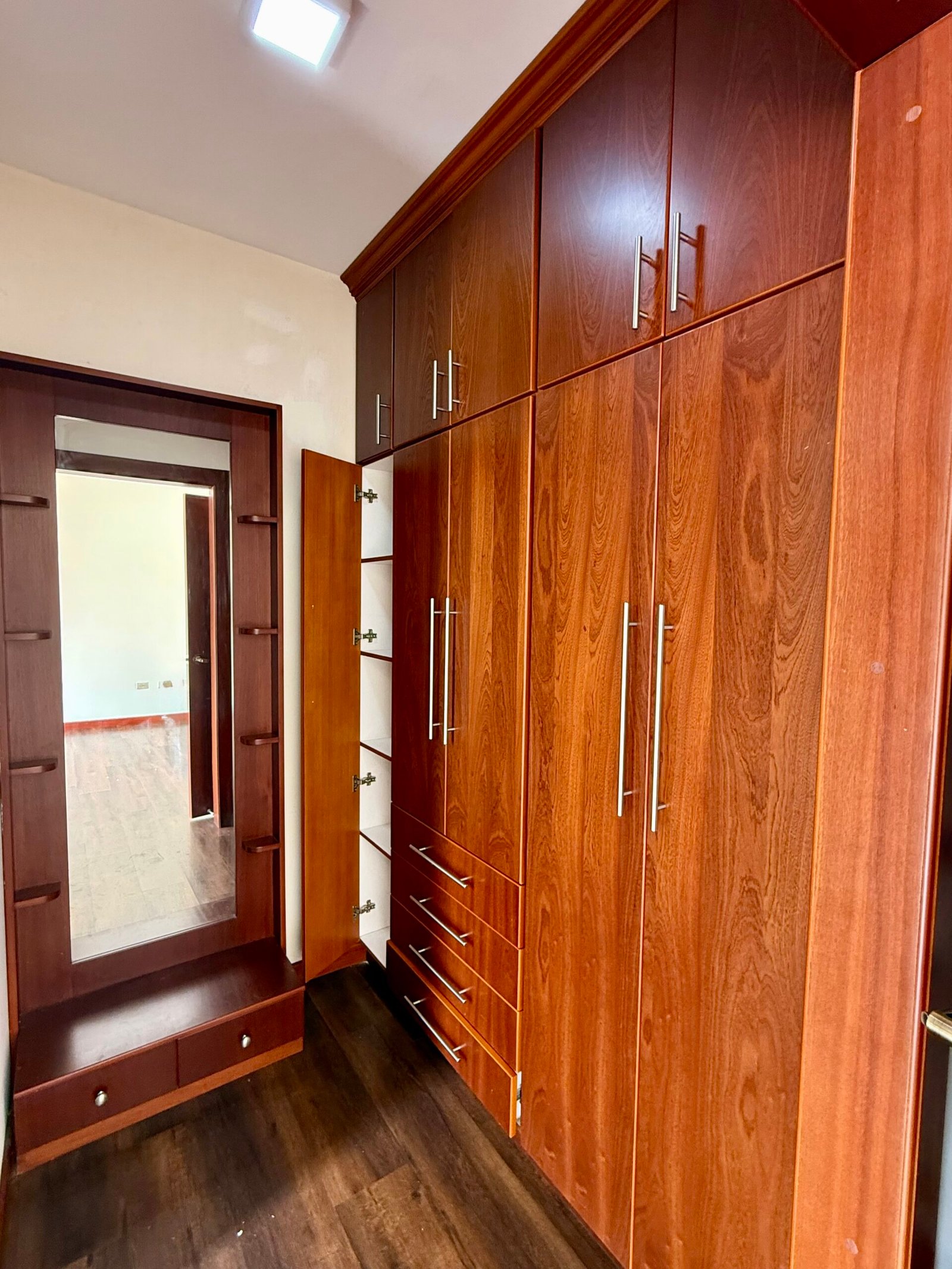 Built-in wooden wardrobe in a bedroom