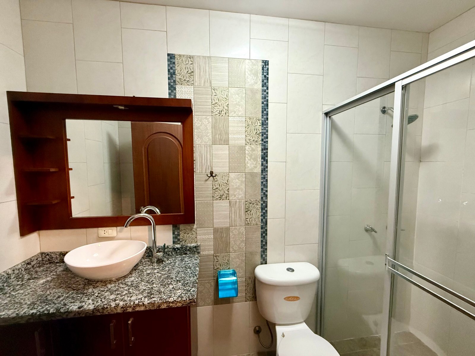 Bathroom with vanity and glass shower