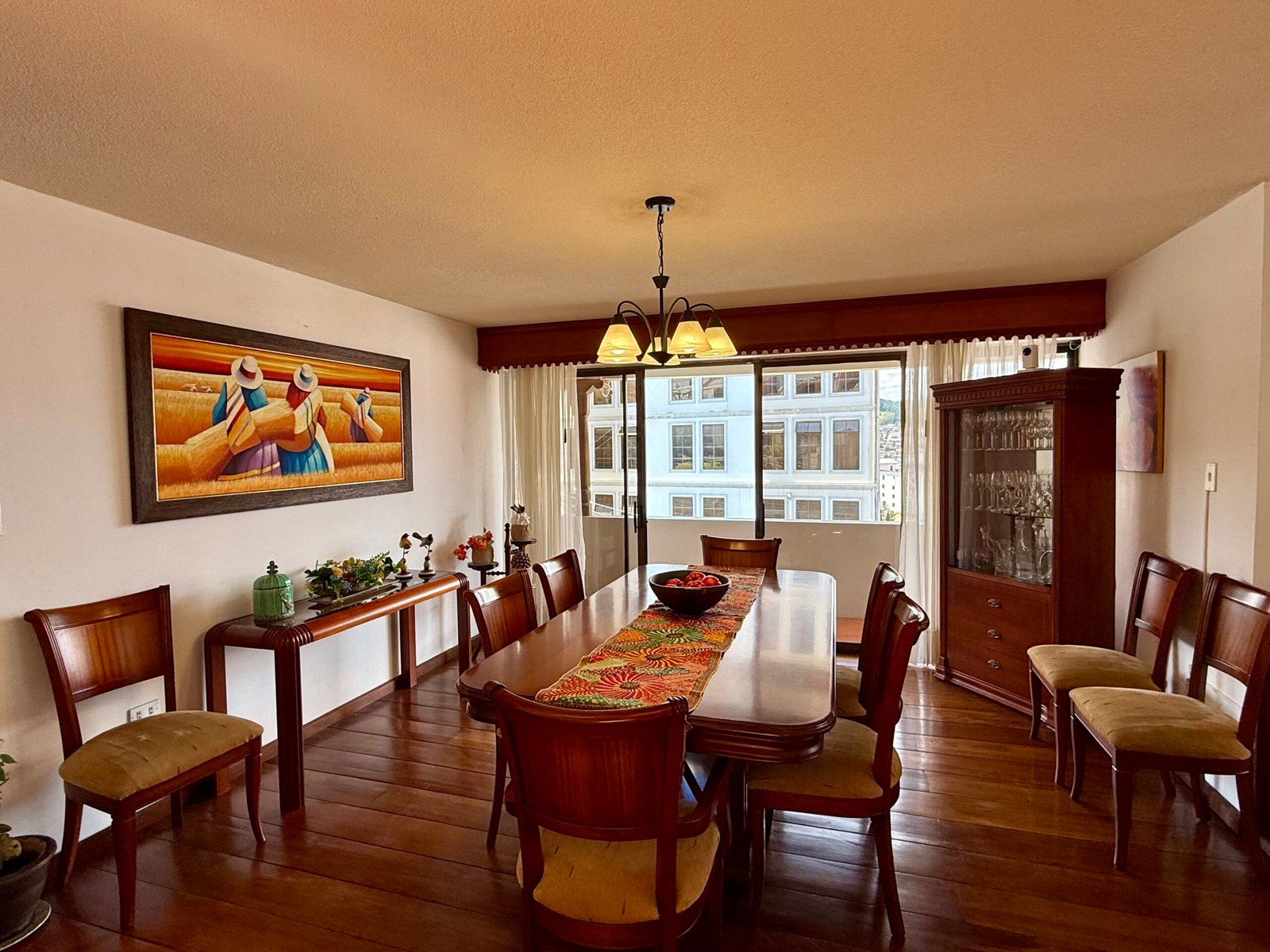 Dining room with pendant lighting and wood cabinetry