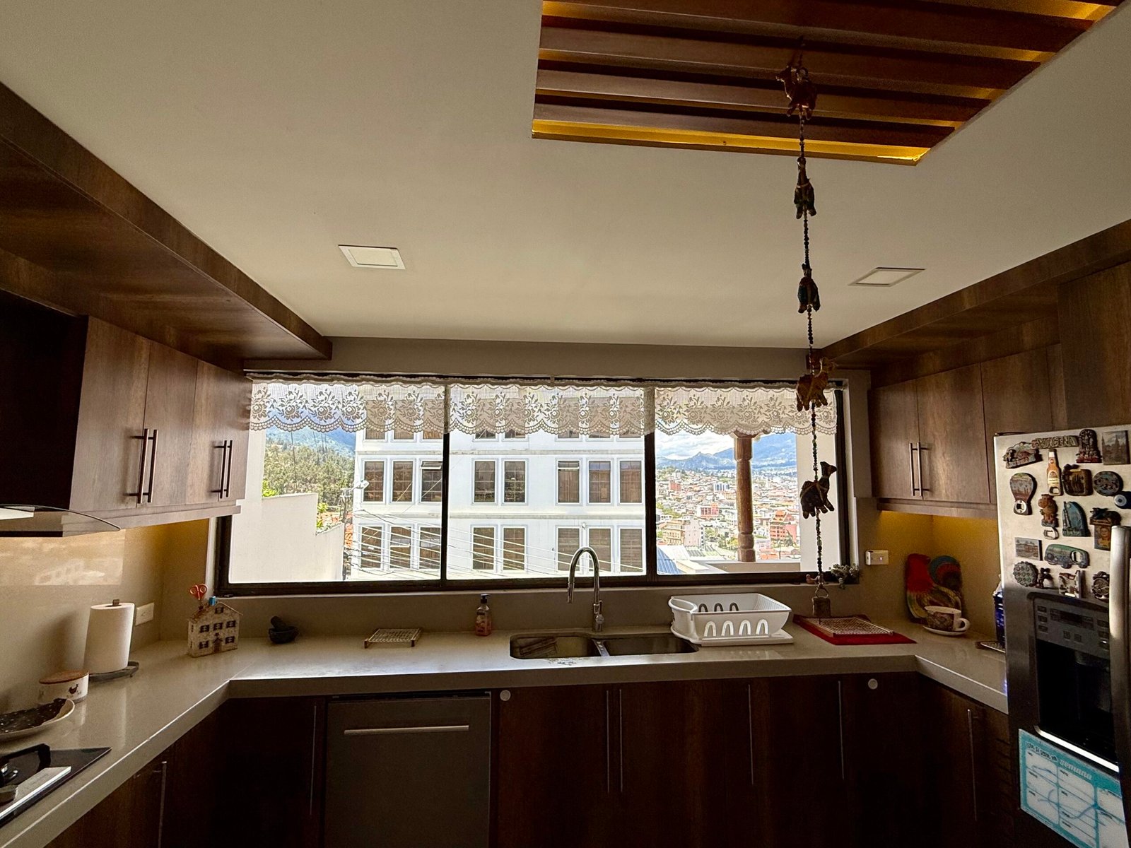 Kitchen and dining spaces with exposed ceiling beams