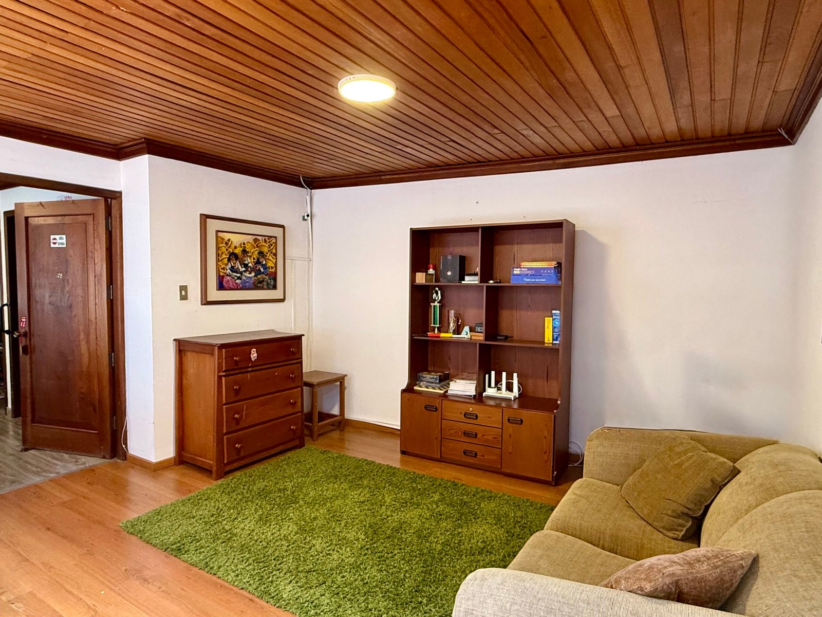 Family sitting room with wood ceiling details