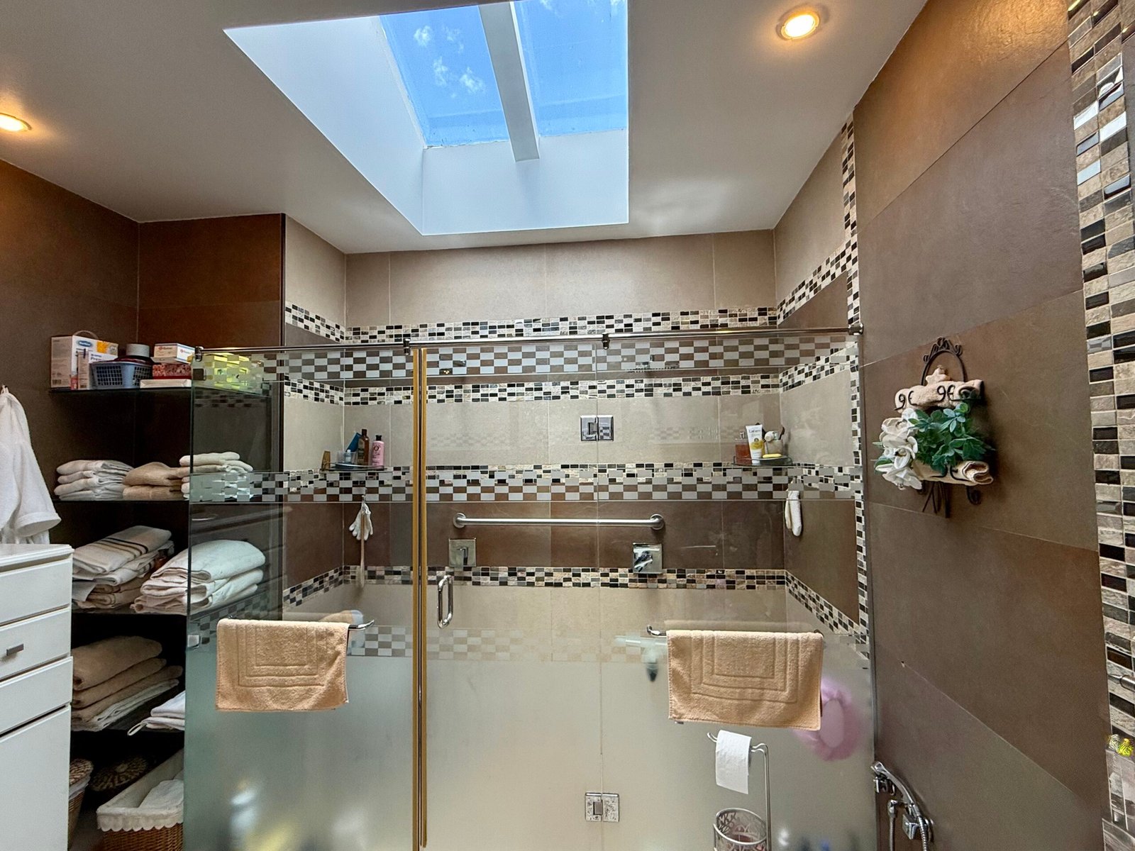 Light-filled corridor with overhead skylight