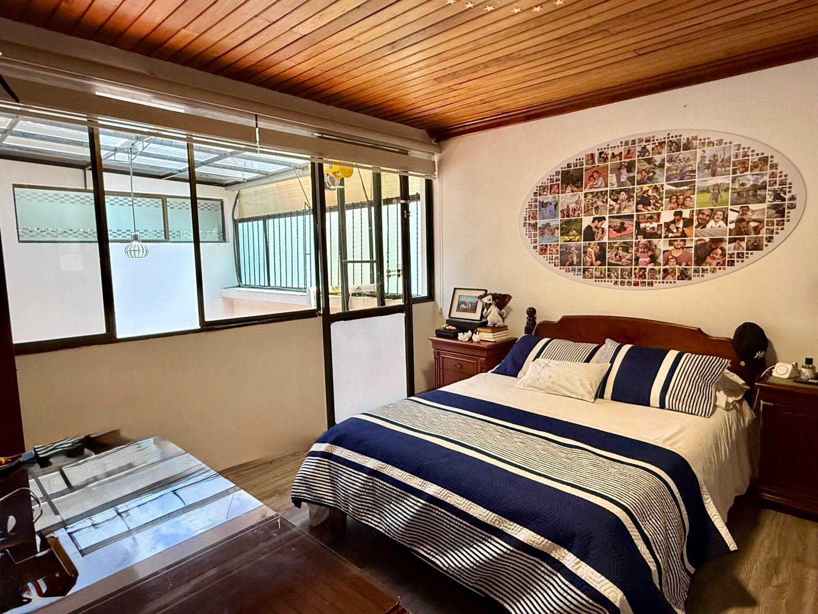 Enclosed terrace with wood ceiling and large windows