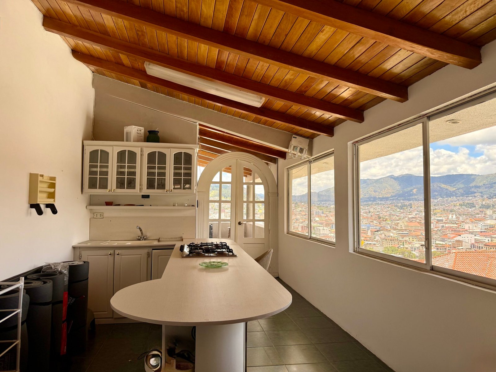 Serving area inside the event hall with panoramic city views