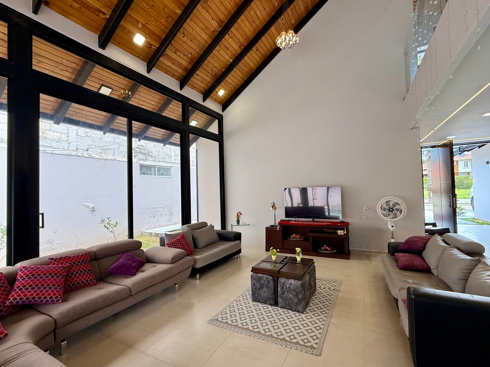 Bright enclosed living area overlooking the garden