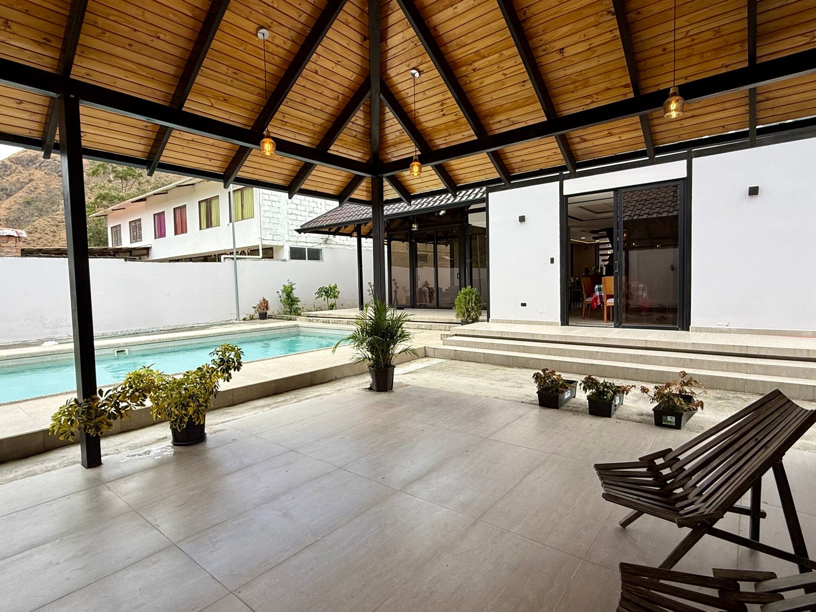 Covered poolside terrace and outdoor social area