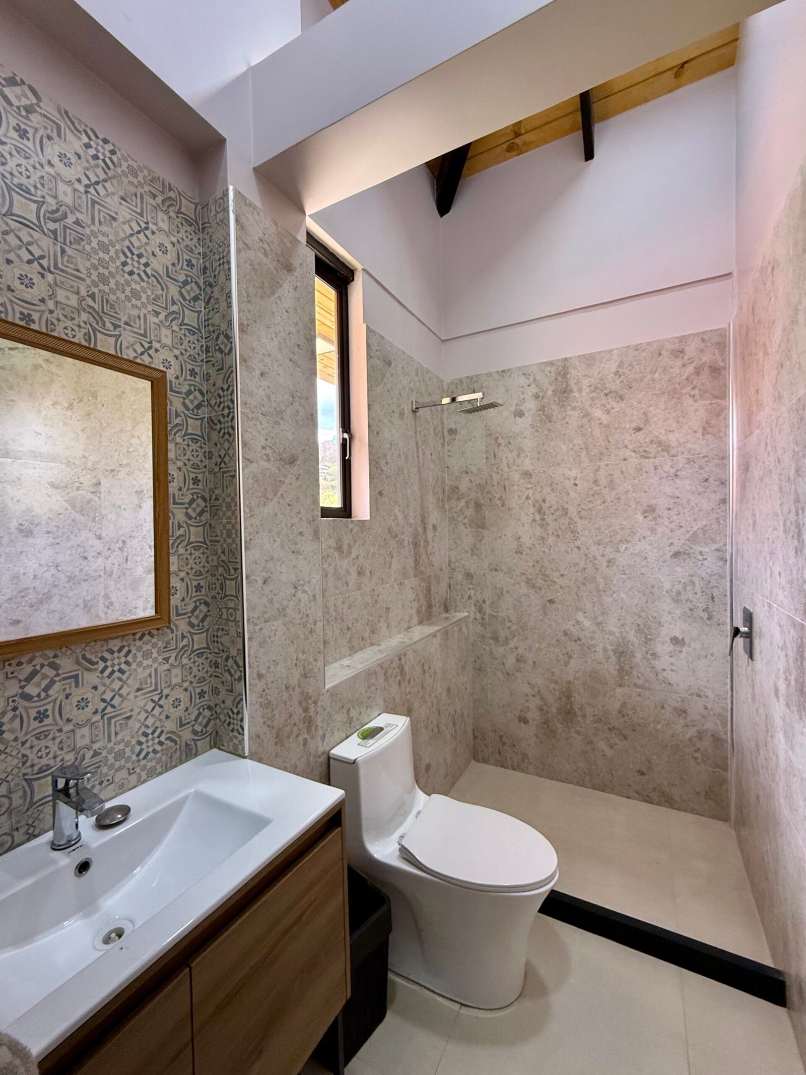 Walk-in shower with decorative tile finishes