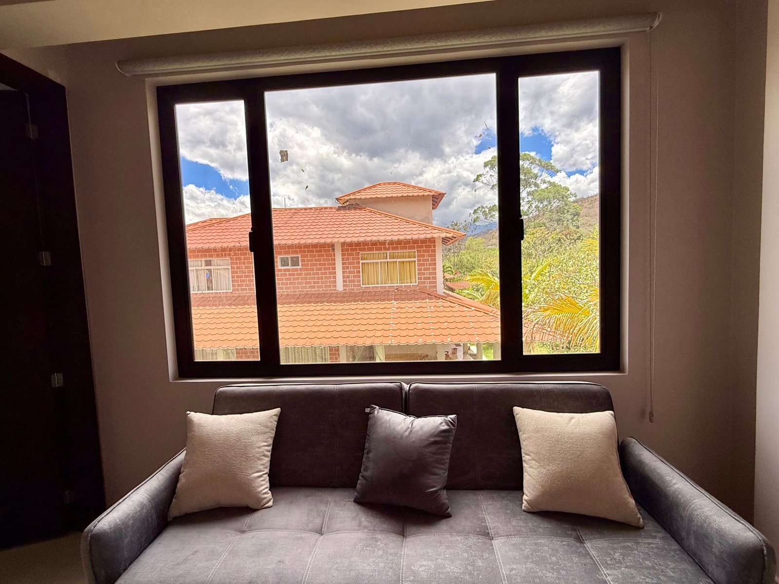 Private sitting area with wide window and built-in shelving